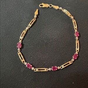 Yellow gold 10K ruby and diamond bracelet